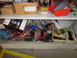 shelves filled with assorted items in a room with a yellow line