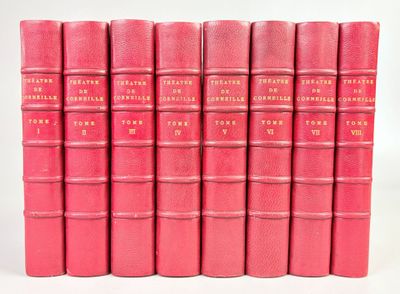 six livres roses alignés les uns à côté des autres sur une surface blanche