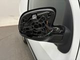 a side view mirror of a car with the door handle open