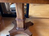 an image of a wooden table on wheels on a hard wood floor
