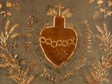 a picture of a painting of a sacred heart on a wall