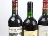 three bottles of wine sitting next to each other on a table