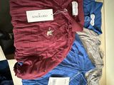 a pile of clothing that is sitting on the floor