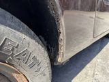 a close up of a tire on the side of a truck