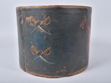 an old wooden box with two swords painted on it