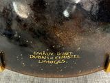a close up of a vase that has a label on it