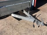 a close up of a trailer with a flat bed on the side of it