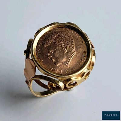 une image représentant une bague contenant une pièce de monnaie