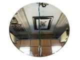 a picture of a mirror hanging on the wall in a room