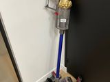 a vacuum that is sitting on the floor next to a door
