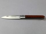 a knife that is laying on a table