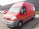 a red van that is parked in a parking lot