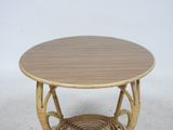 a small table with a basket on top of it