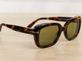 a close up of a pair of sunglasses on a table