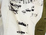 a close up of a person wearing a jacket with writing on it