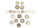 une image représentant une croix composée de pièces de monnaie sur fond blanc
