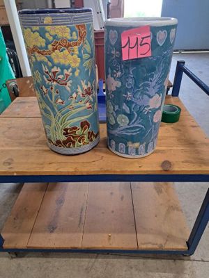two vases sitting on top of a wooden table