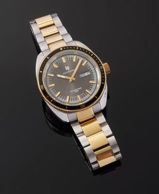 a close up of a wrist watch on a black surface