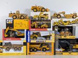 a lot of toy construction vehicles on display on the table
