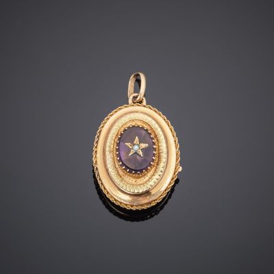 a gold and amethorate locke with a star in the center