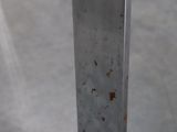 a close up of a knife on a table with a blurry background