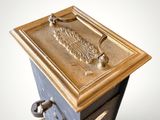 an image of a wooden box with a metal handle on top of it