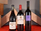 three bottles of wine sitting next to each other on a table