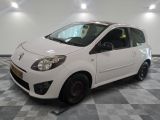 a picture of a small white car parked in a garage