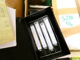 a black box with three files and a pair of scissors in it