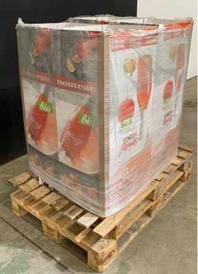 a pallet with a large box of fruit on top of it
