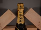 a bottle of champagne that is sitting on a table