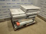 a stack of boxes sitting on a pallet in a room