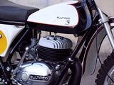 a white and black motorcycle parked on the side of the road