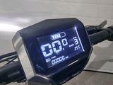a digital clock on the handlebar of a motorcycle