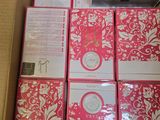 a lot of pink and white cards in a box