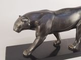 statue of a black panther on a black base on a white background