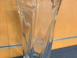 a glass vase that is sitting on a table