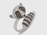 a close up of a ring with black and white diamonds