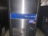 an image of a stainless steel ice machine on a counter