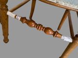 an image of a wooden chair with a blue upholstered seat