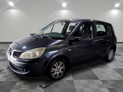 a picture of a small blue car parked in a garage