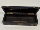 a small black box with gold decorations on it