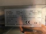 a person that is holding a ticket in an oven