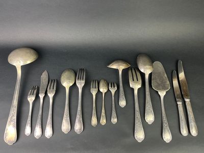 a lot of forks and spoons on the table