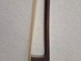 a wooden stick and a wooden stick on a white surface