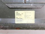 a close up of a metal box with a label on it