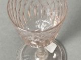 a glass cup that is sitting on a table