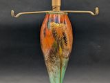 an image of a colorful glass lamp on a table