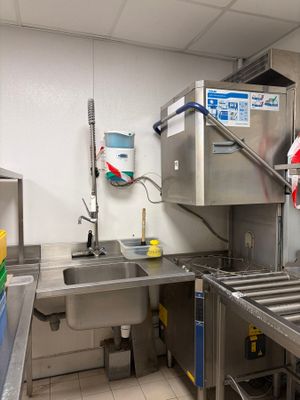 a kitchen with stainless steel appliances and a sink