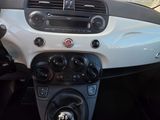 a dashboard of a small car with a steering wheel